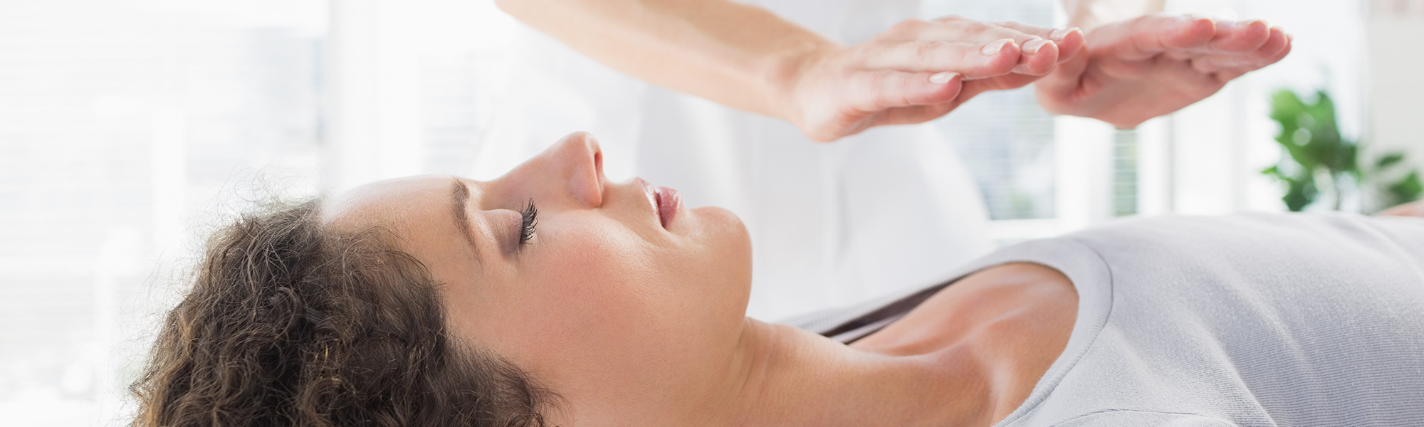 Lady receiving chakra healing meditation in Ocean Township, NJ. 