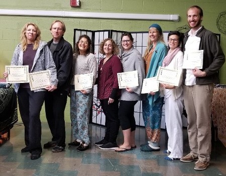 Group of people holding their certifications after taking Reiki classes in Ocean Township, NJ.